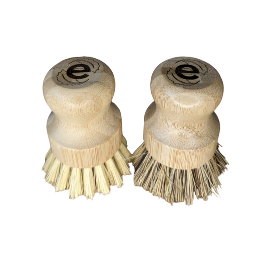 2 elmkind scrubbing brushes, one with soft bristles and one with hard bristles on a white background